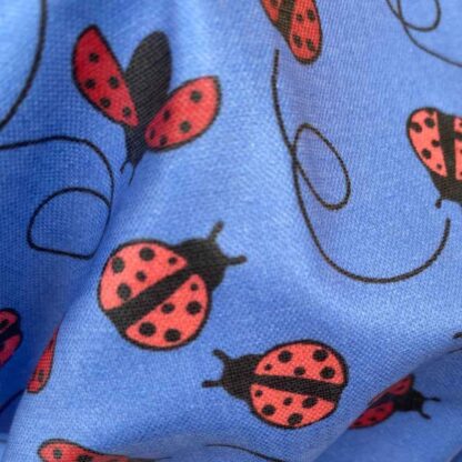 ladybirds fabric close up laminated cotton