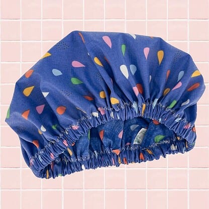 raindrops kids shower cap laminated cotton on bathroom tiles